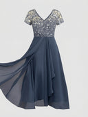 Navy maxi dress with short sleeves, V-neck, and gold speckled bodice, front view on white background.