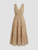 Long sleeve boho mini dress, front view on a neutral background.
