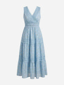 Light blue tiered maxi dress with white and gold polka dots and lace trim, front view.