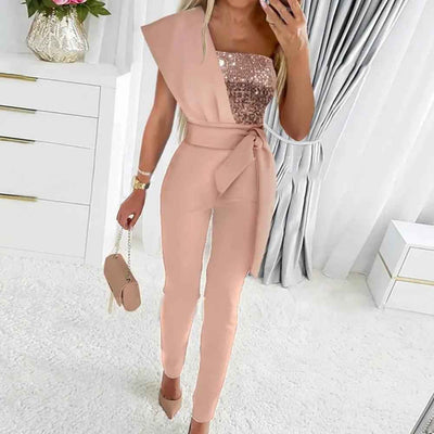 Peach one-shoulder jumpsuit with sequined bodice and waist tie, front view in a room.
