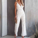 White lace jumpsuit with V-neck, spaghetti straps, and wide legs, front view.