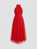 Red halter neck maxi dress with ruched bodice and flowing tulle skirt, front view.
