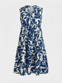 Cream and blue floral print mini dress with V-neck and tiered skirt, front view on white background.