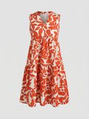 Orange and white floral sleeveless mini dress with V-neck and tiered skirt, front view.