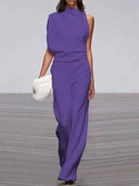 Purple sleeveless crew neck jumpsuit with wide legs, front view on a runway.