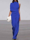 Royal blue sleeveless crew neck jumpsuit with wide legs, front view on a runway.