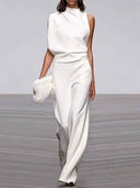 White sleeveless jumpsuit with wide legs, high neck, and cinched waist, front view.