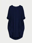 Navy blue mini shirt dress with rolled sleeves and two front pockets, front view.