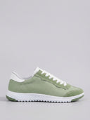 Light green lace-up low-top sneakers with mesh upper, white laces, and white flexible sole, side view.