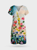 Viola multicolour watercolour floral border print short sleeve mini shift dress, white base with split V-neckline, front view.