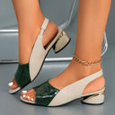 Two-tone low wedge sandal in dark green croc-embossed toe panel and cream strap, gold metallic wedge accent, angled front view on foot.