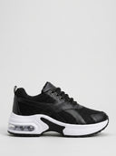 Chunky black lace-up trainers with air-cushion platform sole, size EU 36, side view on white background.