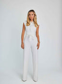 White sleeveless jumpsuit with V-neck, belted waist, and wide legs, front view on white background.