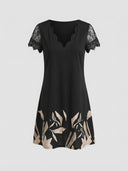 Black midi dress with scalloped V-neck, lace sleeves, and tan leaf print hem, front view.