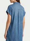 Blair Short Sleeve Denim Mini Shirt Dress in light blue, rear view showing point collar, cuffed short sleeves, and curved hem.