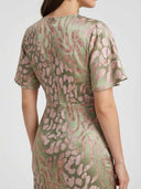 Chloe Bodycon Midi Dress — rear view showing back zip closure and flutter sleeve cut on sage green abstract print satin-look fabric.