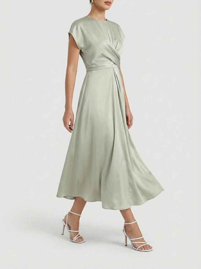 Sage green midi dress with twisted bodice, cap sleeves, and flowing skirt, angled view.