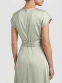 Light green midi dress with cap sleeves, back zipper, and waist tie, back view.