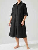Agnes Summer Midi Shirt Dress in black — relaxed A-line silhouette, pointed collar, concealed button-front placket, tab-roll ¾ sleeves, angled front view on light background.