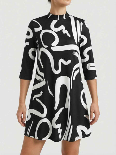 Alanna abstract print mini dress in black with bold white swirl pattern, mock collar neckline and three-quarter sleeves, front view