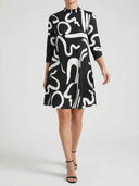 Alanna abstract print A-line mini dress in black and white, relaxed silhouette with three-quarter sleeves, front view