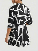 Alanna three-quarter sleeve mini dress in black abstract print, mock collar detail, back angled view showing A-line cut