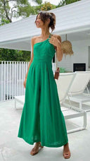 Green asymmetrical strapless jumpsuit with high waistline, front view.