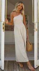 Beige asymmetrical strapless jumpsuit with high waistline, front view.