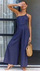 Navy asymmetrical strapless jumpsuit with high waistline, front view.