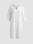 Amber Summer Mini Dress in White — floral embroidered shift mini dress with V-notch neckline and 3/4 sleeves, straight-on front view.