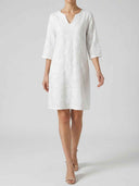 Amber Summer Mini Dress in White — full-length front view of the floral embroidered shift silhouette with relaxed straight cut and mini hem.