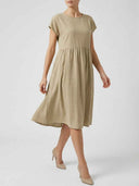 Amelia empire waist midi summer dress in khaki, cap sleeves and gathered A-line skirt, angled front view.
