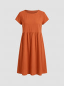 Amelia cap sleeve empire waist midi sundress in orange, front view on grey background.