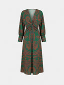 Amelia floral A-line midi wedding guest dress in green with amber botanical print, deep V-neck, twisted waist and long bishop sleeves, front view.