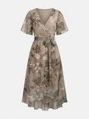 Amelia Flutter Sleeve Floral Midi Dress in warm beige floral print with surplice wrap V-neckline and self-tie waist bow, front view on white background.