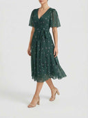 Amelia Flutter Sleeve Floral Midi Dress in deep forest green, showing wrap neckline, flutter sleeves and flared A-line midi skirt, angled front view.