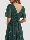 Amelia Flutter Sleeve Floral Midi Dress in deep forest green, showing V-back neckline and self-tie bow waist detail, back view.