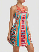 Amelia Halter Neck Mini Summer Dress in Orange/Black multicolour Aztec-tribal geometric print with braided macramé cord lattice halter neckline, A-line mini silhouette, front three-quarter view.