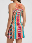 Amelia Halter Neck Mini Summer Dress in Orange/Black multicolour geometric print, back view showing halter neck tie and sleeveless open back.