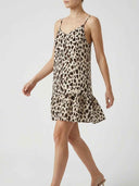 Amelia leopard print spaghetti strap mini dress, angled side view highlighting ruffled drop-hem tier and lightweight fluid fabric.
