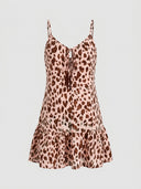 Amelia spaghetti strap mini dress in pink leopard print, front view on white background showing ruffled hem and V-neckline.