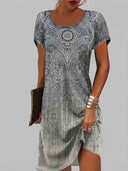 Amelia short sleeve mini dress in black and white paisley print, front view on grey background