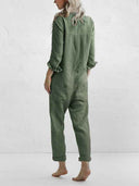 Olive green long-sleeve jumpsuit with rolled cuffs and back pockets, rear view.