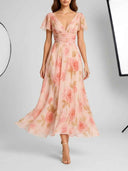 Pink floral V-neck maxi dress with flutter sleeves, front view.