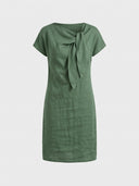 Beatrice cap sleeve bow detail mini dress in green, front view showing asymmetric bow-knot neckline and fitted sheath silhouette.