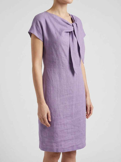 Beatrice cap sleeve bow-knot neckline mini dress in lilac, angled front view showing sheath silhouette and front bow tie detail.