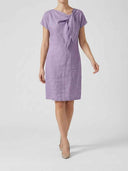 Beatrice cap sleeve mini dress in lilac, close front view of the bow-knot tie detail at the asymmetric neckline.