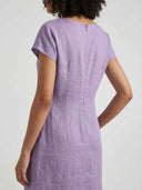 Beatrice cap sleeve bow detail mini dress in lilac, angled back view showing back zip closure and cap sleeve cut.