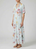 Beatrice Floral V-Neck Maxi Summer Dress in Sky Blue showing A-line maxi silhouette and short sleeves, side view.