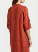 Beatrice linen-look maxi dress in rust terracotta, back view on white background showing maxi length and three-quarter tab-roll sleeves.